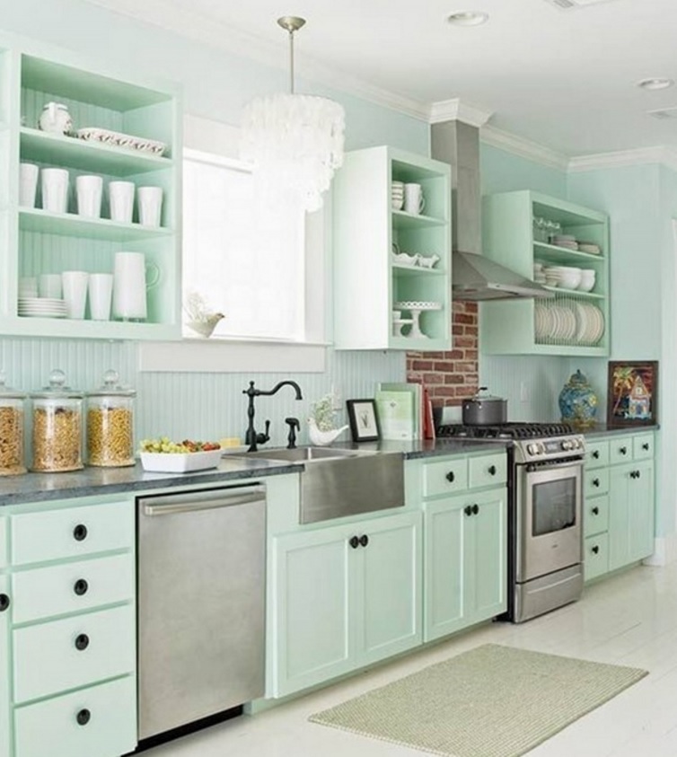 Mint colored backsplash coincides with the color of cabinets