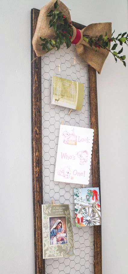framed chicken wire is a great piece to hang photos and cards
