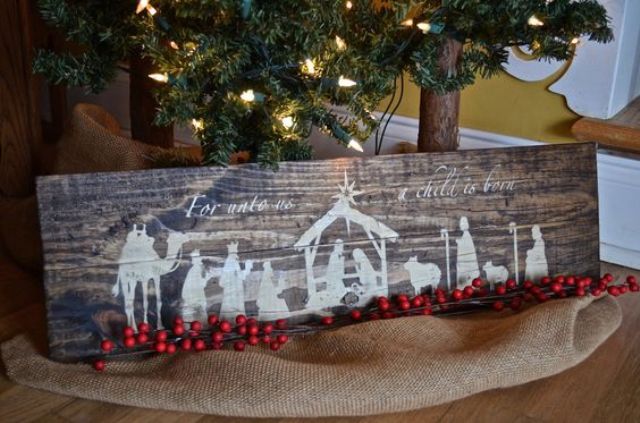 rustic wooden nativity sign made with white paint