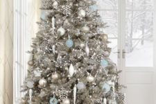 15 stunning silver tree with white, silver and light blue ornaments that reminds of Christmas wonderland