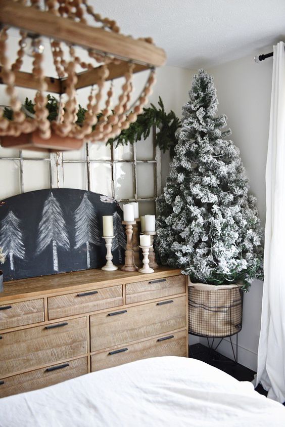 a flocked Christmas tree and trees on a chalkboard can be enough for neutral decor