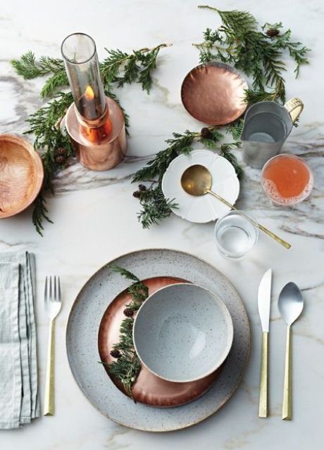 copper chargers, plates and candle holders