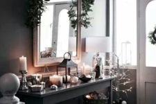 16 decorate your entryway in moody colors and spruce the decor with lots of candles and lights
