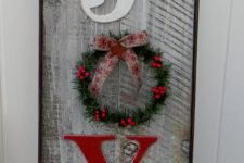 16 weathered wooden JOY sign with a small wreath