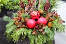 17 a large urn, evergreens, pinecones, berries, leaves and oversized ornaments