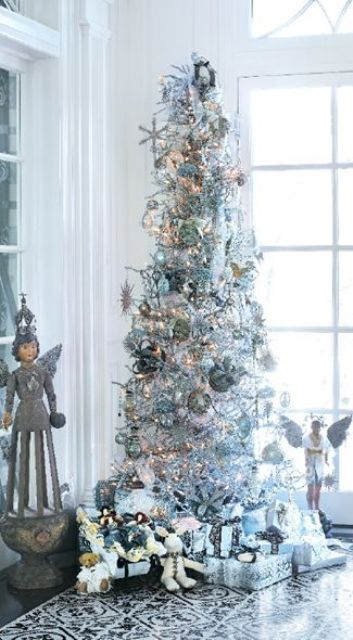 a silver tree with metallic ornaments