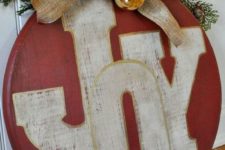 17 red ornament JOY sign with gold ornaments and a burlap bow