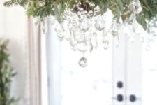 17 vintage chandelier decorated with foliage, evergreens and crystals
