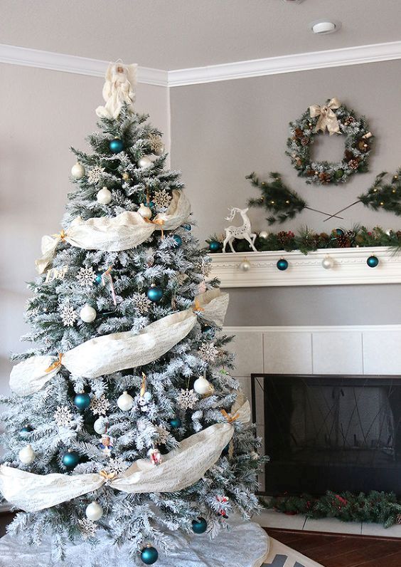Emerald and white ornaments and fabric garlands look eye catching