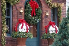18 greenery and oversized ornaments with red ribbon