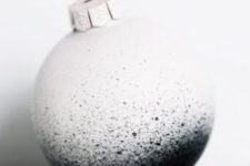 18 spray-painted black and white ornaments