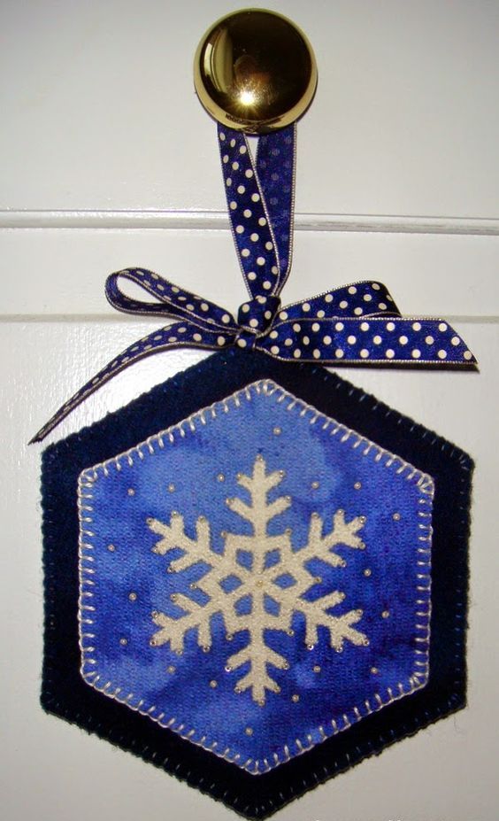 stitched wool door hanger with a snowflake