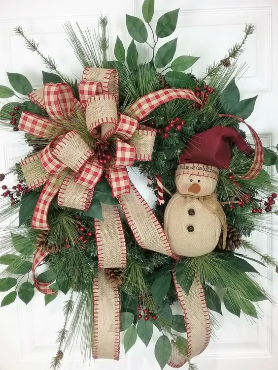 vintage-inspired wreath with a burlap bow and a snowman