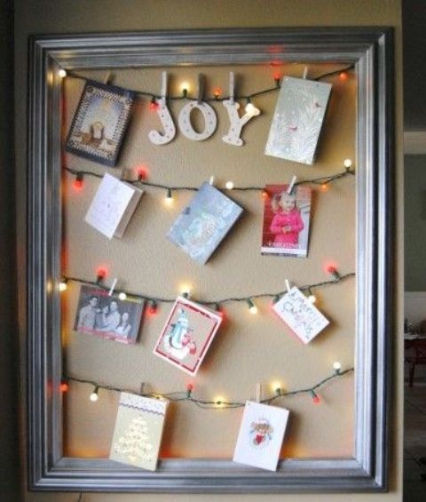 hang the cards right on the light garlands in a frame