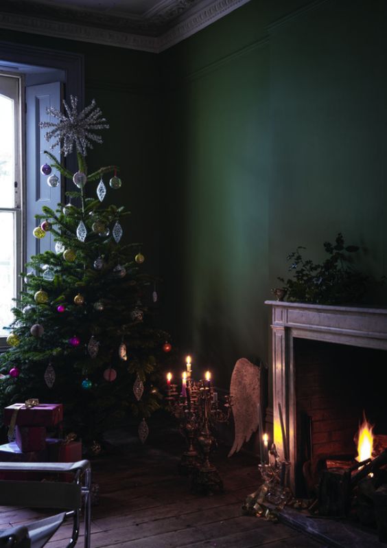 moody Christmas decor with bold vintage ornaments and a working fireplace