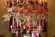 20 beautiful Christmas chandelier with hanging red ornaments, vintage ribbon and evergreens