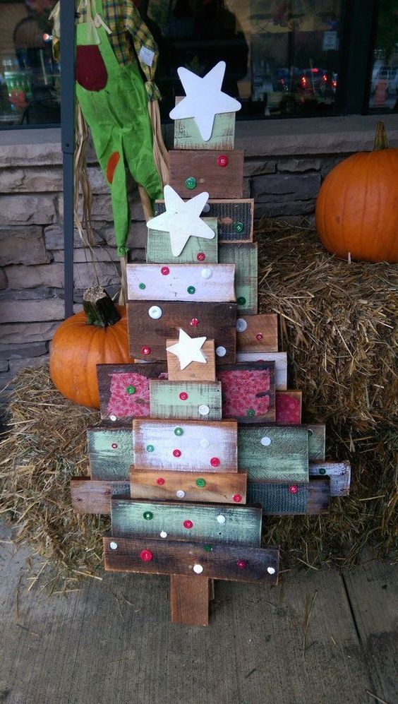 colorful reclaimed wood Christmas trees with button decor