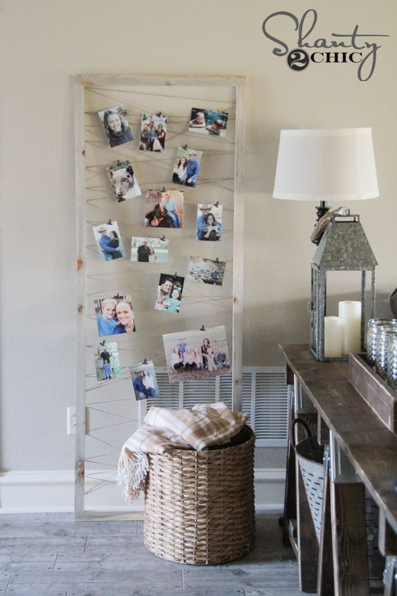hang threads in a frame and attach pictures and cards inside