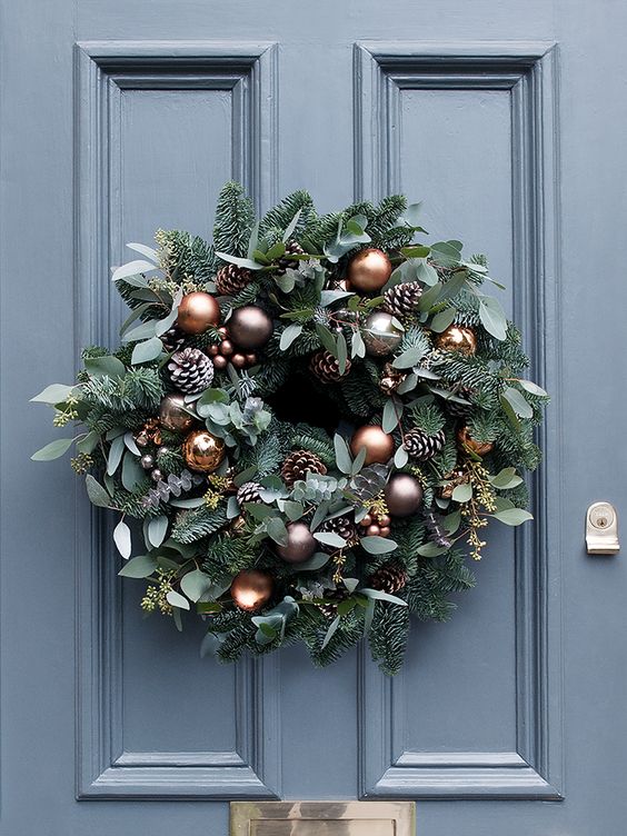 beautiful copper and mink baubles, frosted pine cones and miniature copper bells for the wreath