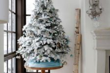 21 icy blue and gold ornaments for decorating a tree