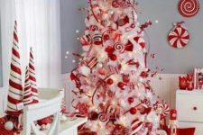 22 whimsy wwhite tree with red and white decorations and ornaments