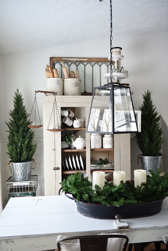decorate your home with evergreens and candles with no other decor and keep it neutral