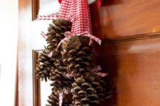 23 gather pinecones in your yard and add a chunky ribbon.
