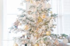 13 silver and pearl ornaments highlight the tree decor and make it amazing