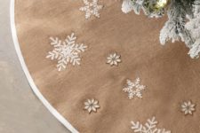 a beautiful burlap tree skirt with white applique snowflakes and stars is a gorgeous idea for a modern farmhouse Christmas tree