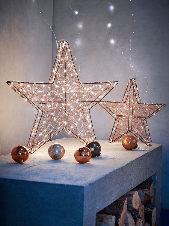 copper lit up stars and ornaments for decor
