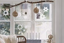 25 hang a branch and ornaments of various kinds on it, and add paper snowflakes