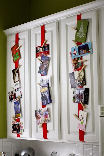 attach red ribbon to the cabinets and then cards on it