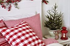 26 cover your headboard with berries and use red and white bedding for winter holidays