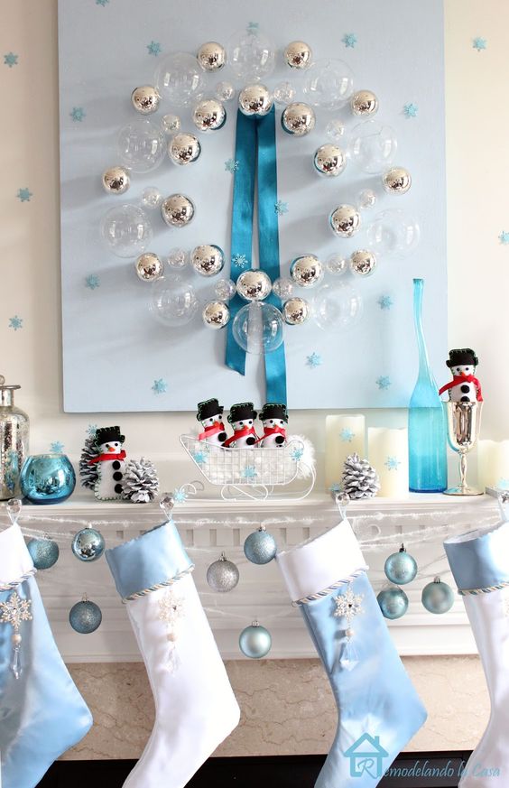 serenity blue and white ornaments and stockings for mantel decor