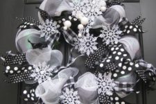 27 a black and white deco mesh wreath with snowflakes
