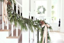 27 evergreen garland with pinecones and neutral bows