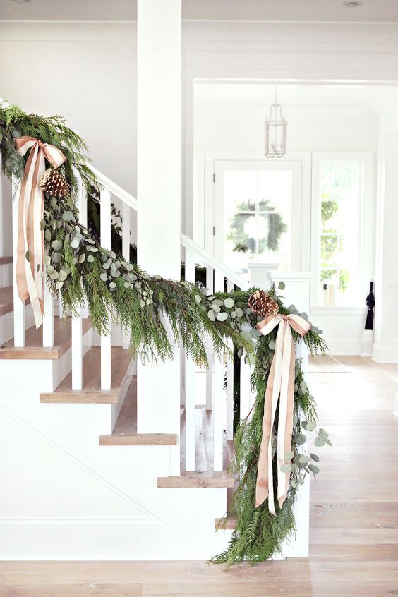 evergreen garland with pinecones and neutral bows