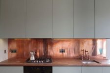 27 warm copper adds a sense of luxury to this kitchen