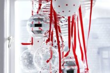 28 a cluster of red, white and silver ornaments will be great for window decor