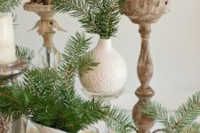 28 large pinecones, evergreens and candles are perfect for decorating a table