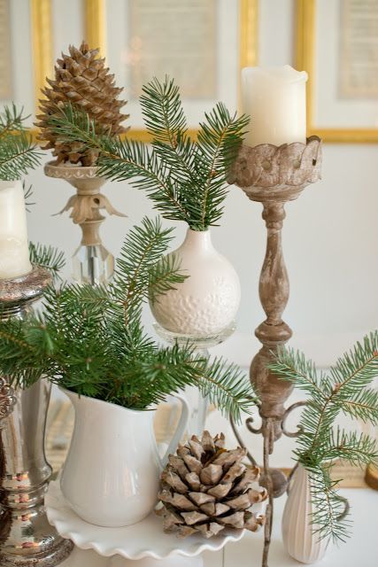 large pinecones, evergreens and candles are perfect for decorating a table