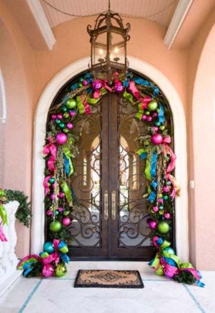 super bold Christmas ornament garland over the door