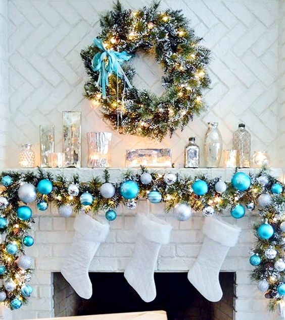 blue, silver and white Christmas garland and white stockings never looked cuter than that