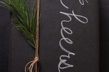 29 chalkboard gift wrapping with evergreens and chalk writing