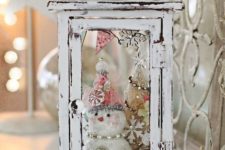 29 fill a shabby chic lantern with a couple of cute little snowmen
