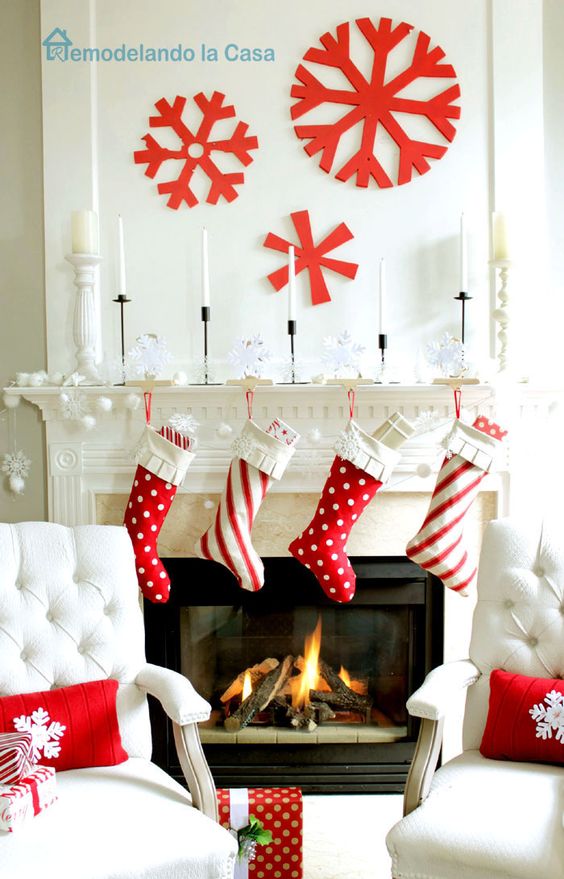 red and white stockings, large red snowflakes on the wall