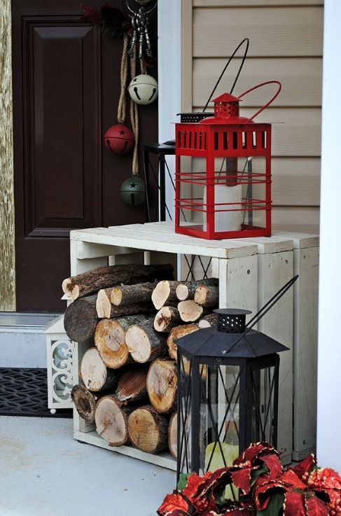 a firewood stand and a couple of lanterns