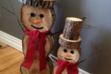 32 reclaimed wood snowmen with red bows