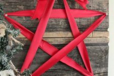 33 reclaimed wooden board decor with a red ribbon star