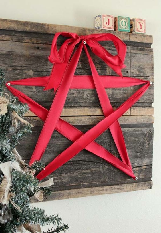 reclaimed wooden board decor with a red ribbon star